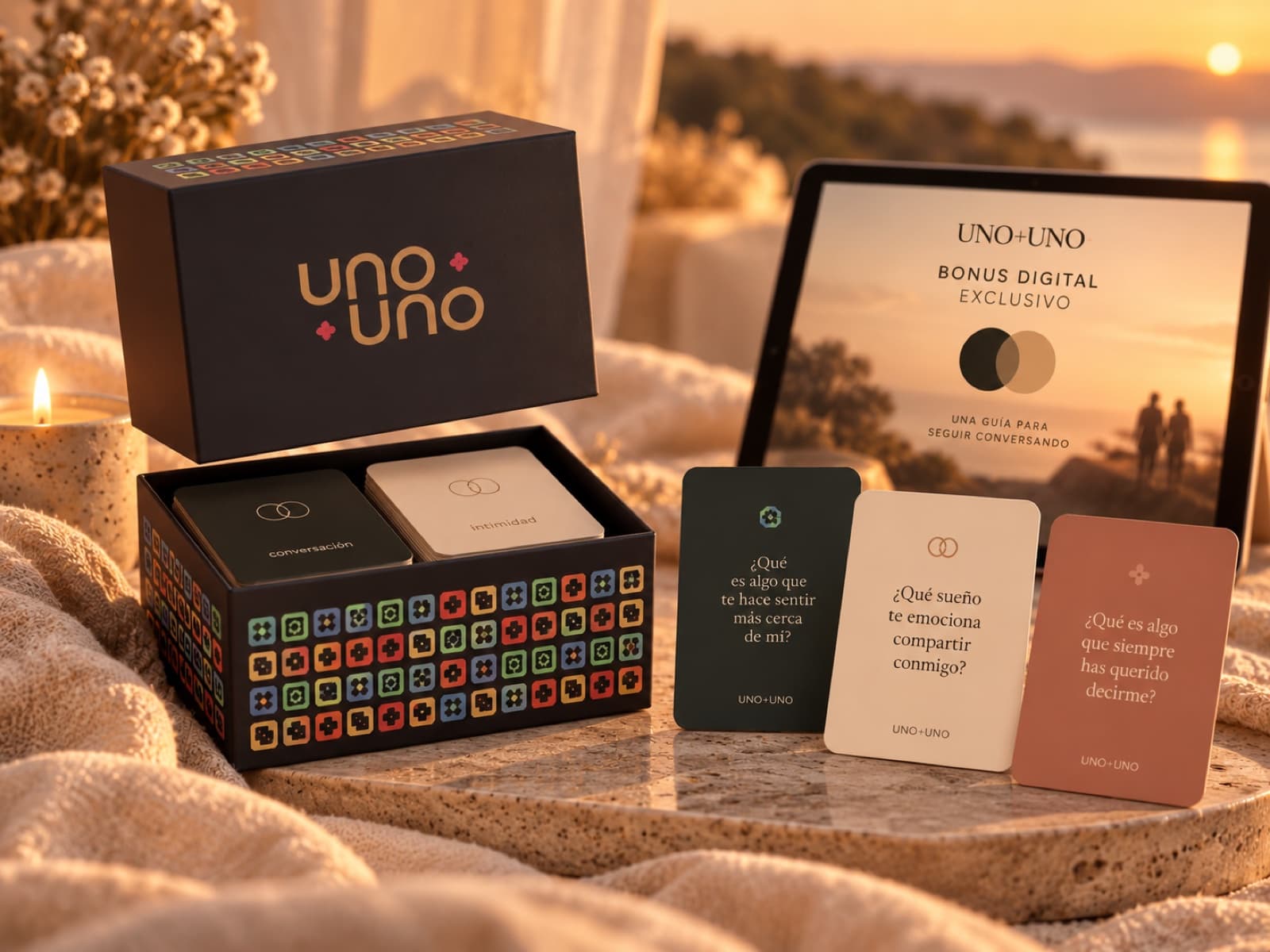 Caja de UNO+UNO junto a una tableta con la guía digital exclusiva de preventa